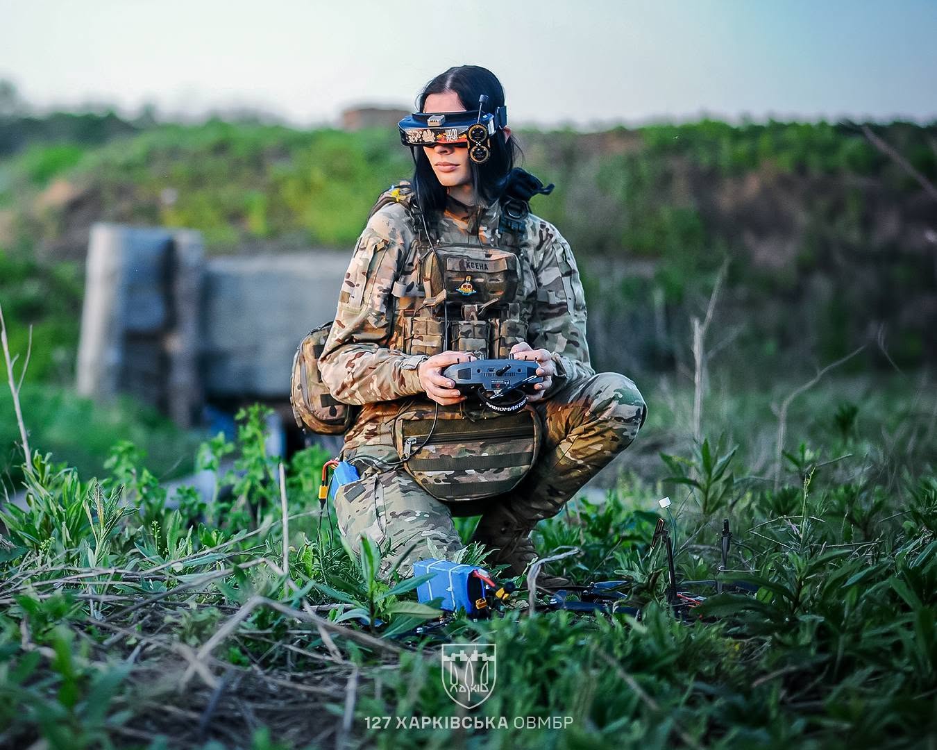 A Ukrainian soldier operating an FPV drone with headset goggles
